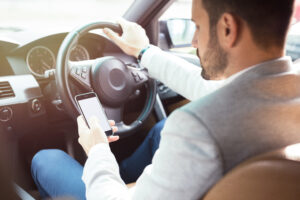 Photo of New laws to clamp down on mobile phone use at the wheel