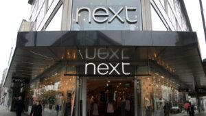 Photo of Fashion retailer Next cuts sick pay for unvaccinated staff