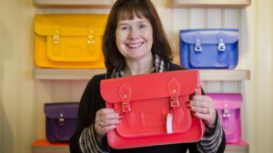 Photo of Cambridge Satchel Company founder Julie Deane packs her bags after sale to Chargeurs