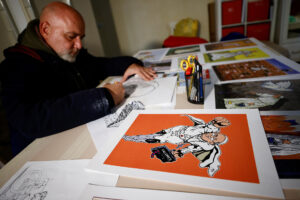 Photo of Rome street artist’s career took flight by painting pope as superhero