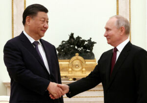 Photo of Putin meets ‘dear’ friend Xi in Kremlin
